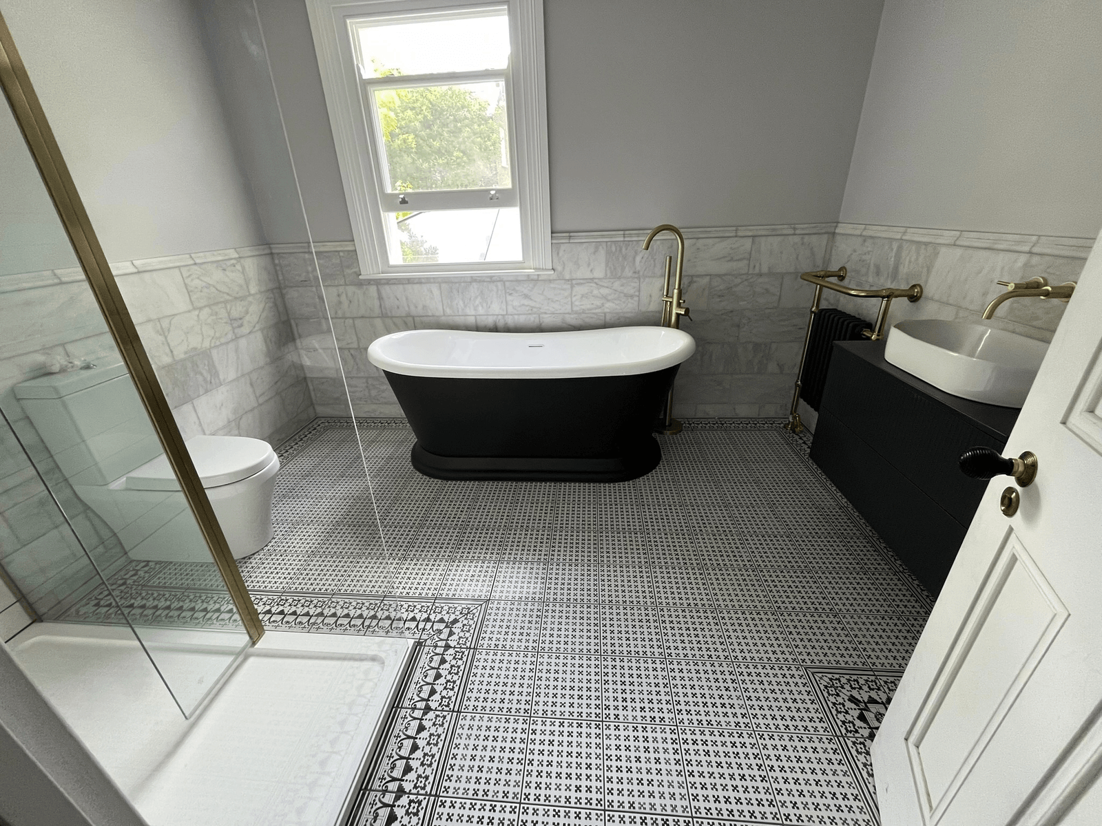 Luxury bathroom transformation in Herne Hill with custom vanity unit and hand-painted cabinetry